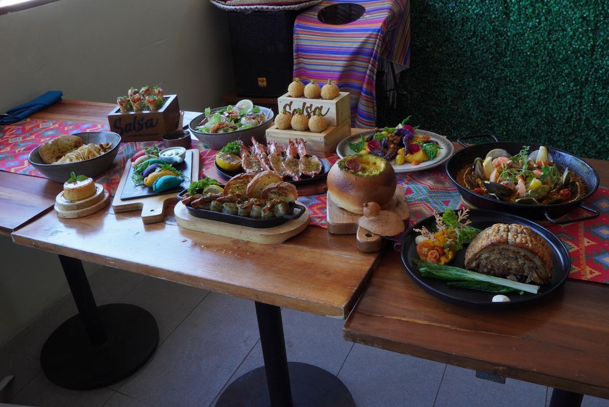 A long table laid with Salsa's colourful shared plates.